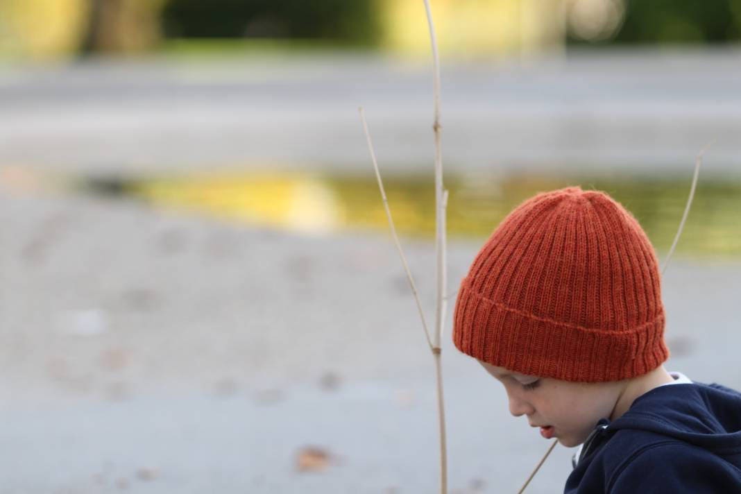 Rust/ burnt orange knitted alpaca beanie hat for babies, toddlers and children. Handcrafted in Scotland. Unisex design.