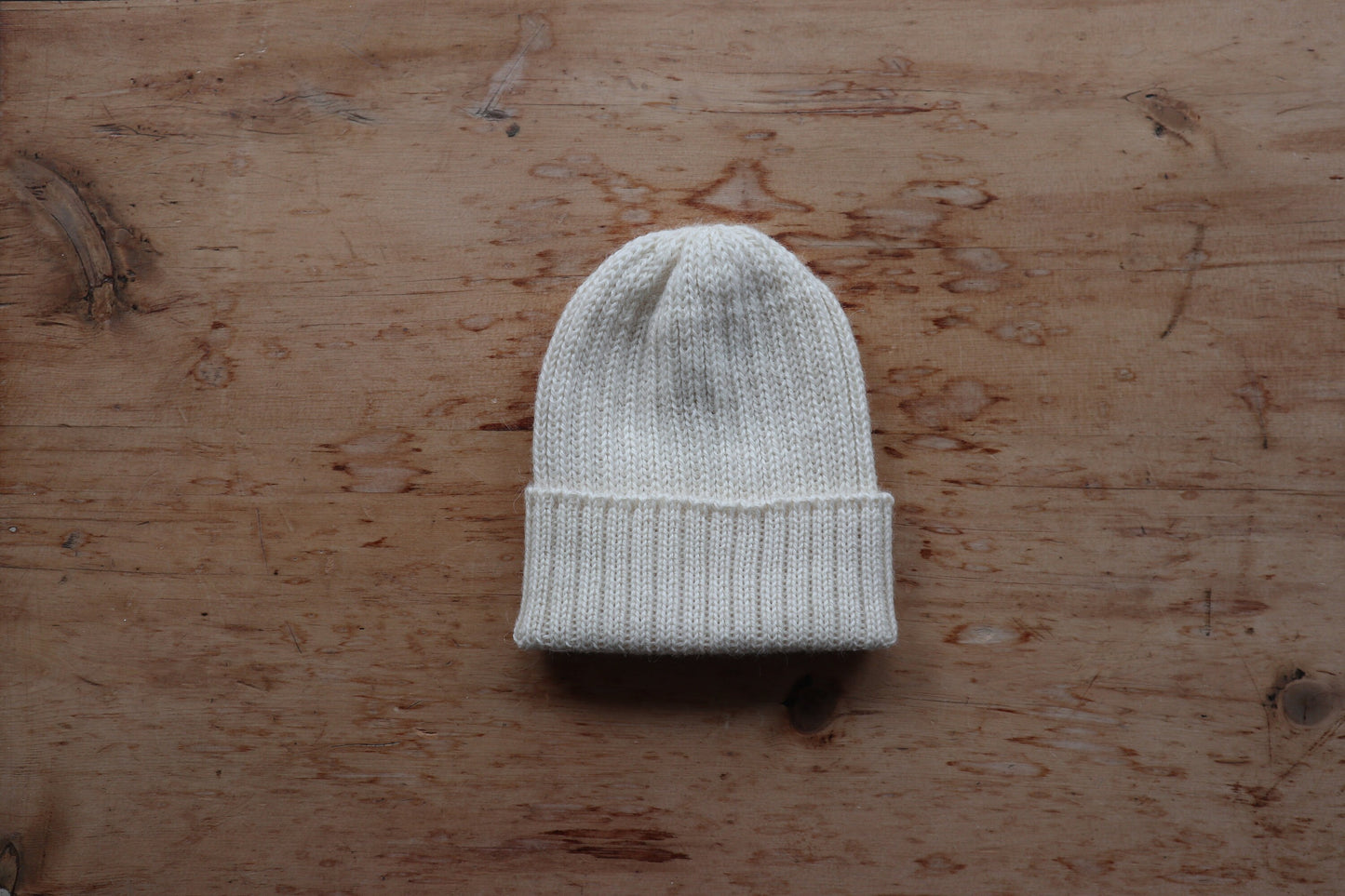 Ecru/ off-white knitted 100% alpaca beanie hat for babies, toddlers & children. Handcrafted in Scotland. Unisex cream watch cap.