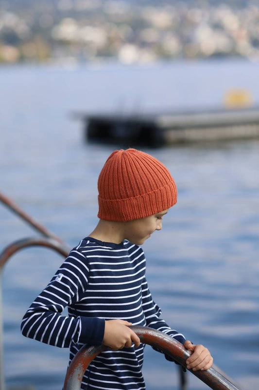 Sherbet orange knitted alpaca beanie hat for babies, toddlers and children. Handcrafted in Scotland. Unisex design.