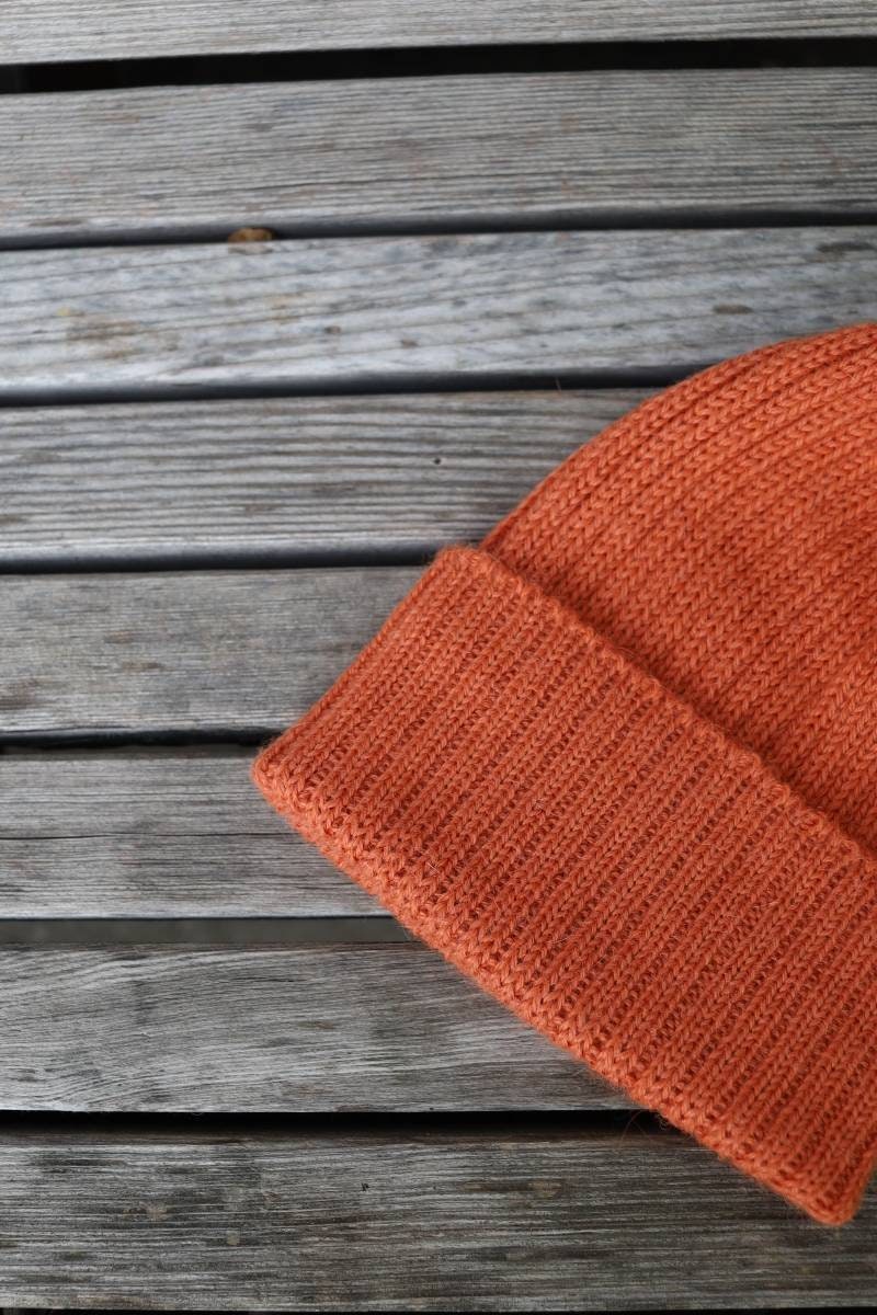 Sherbet orange knitted alpaca beanie hat for babies, toddlers and children. Handcrafted in Scotland. Unisex design.