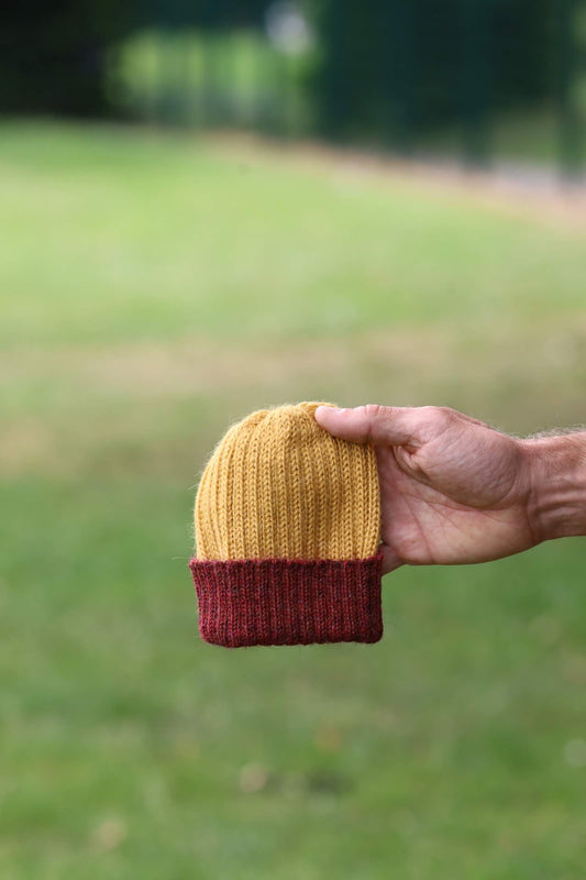 Mustard and maroon knitted 100% alpaca beanie hat for babies, toddlers & children. Handcrafted in Scotland. Unisex newborn watch cap.