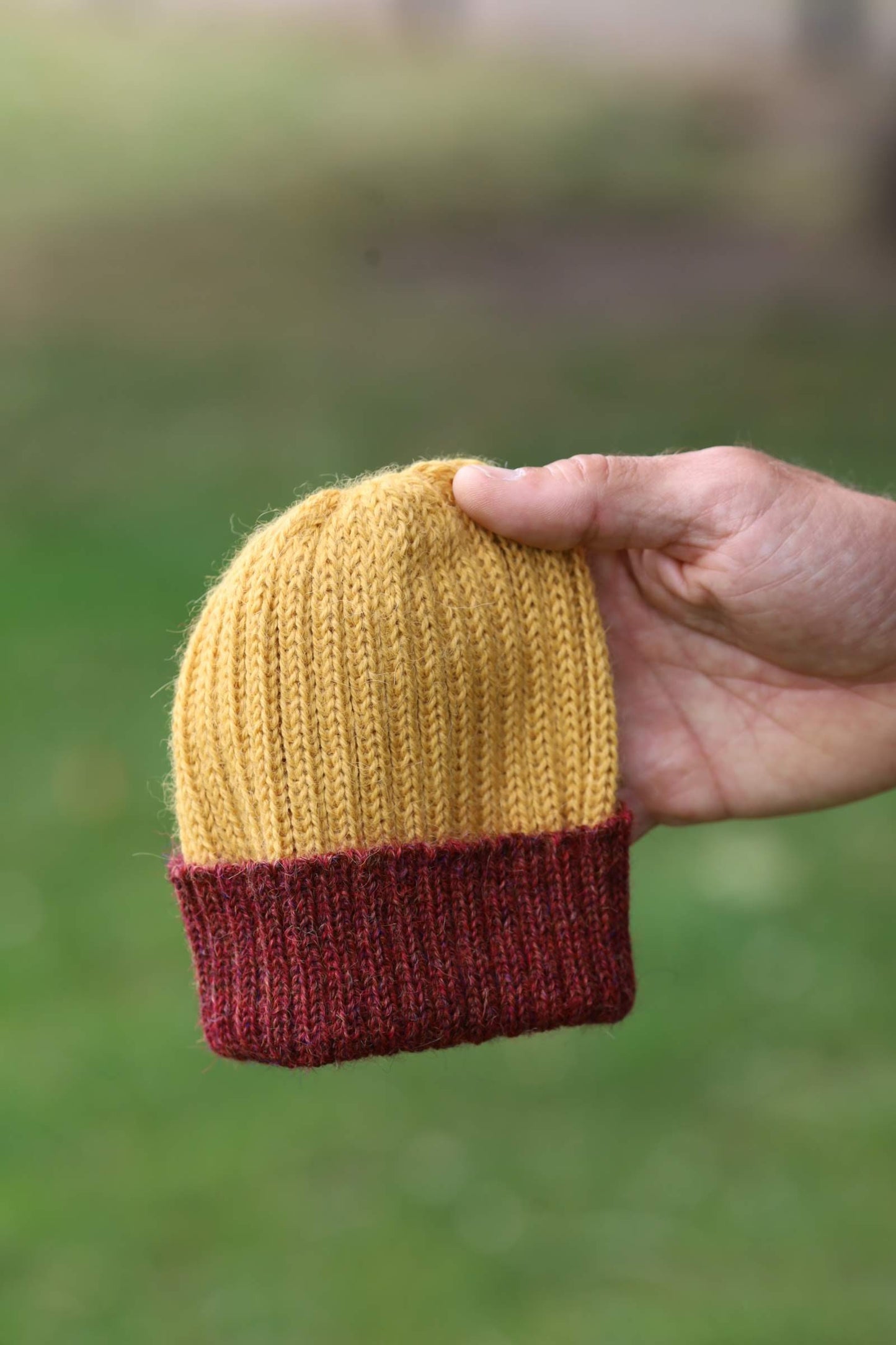 Mustard and maroon knitted 100% alpaca beanie hat for babies, toddlers & children. Handcrafted in Scotland. Unisex newborn watch cap.