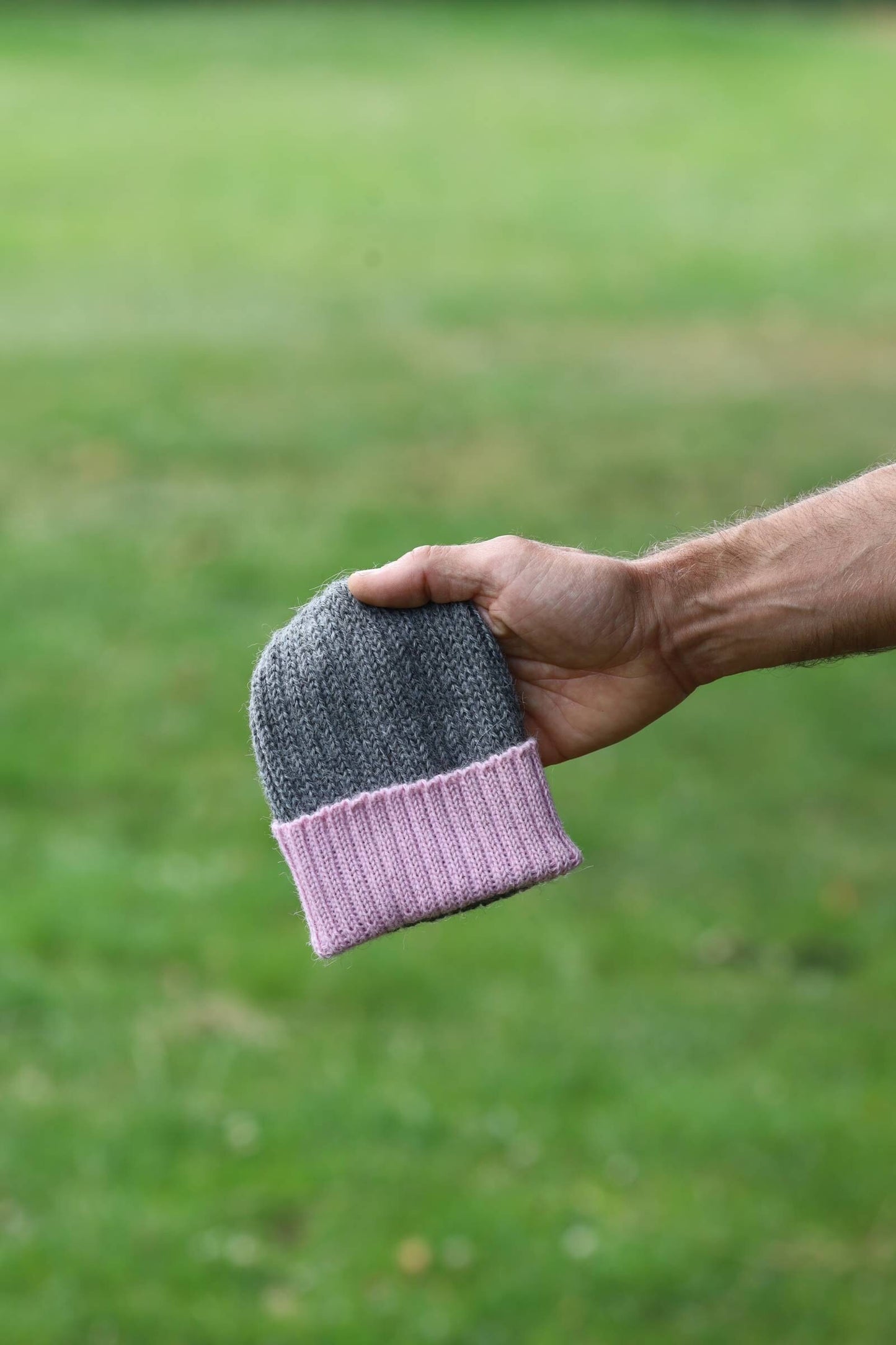 Grey/dusty pink knitted 100% alpaca beanie hat for babies.  Handcrafted in Scotland. Unisex grey/dusty pink watch cap.