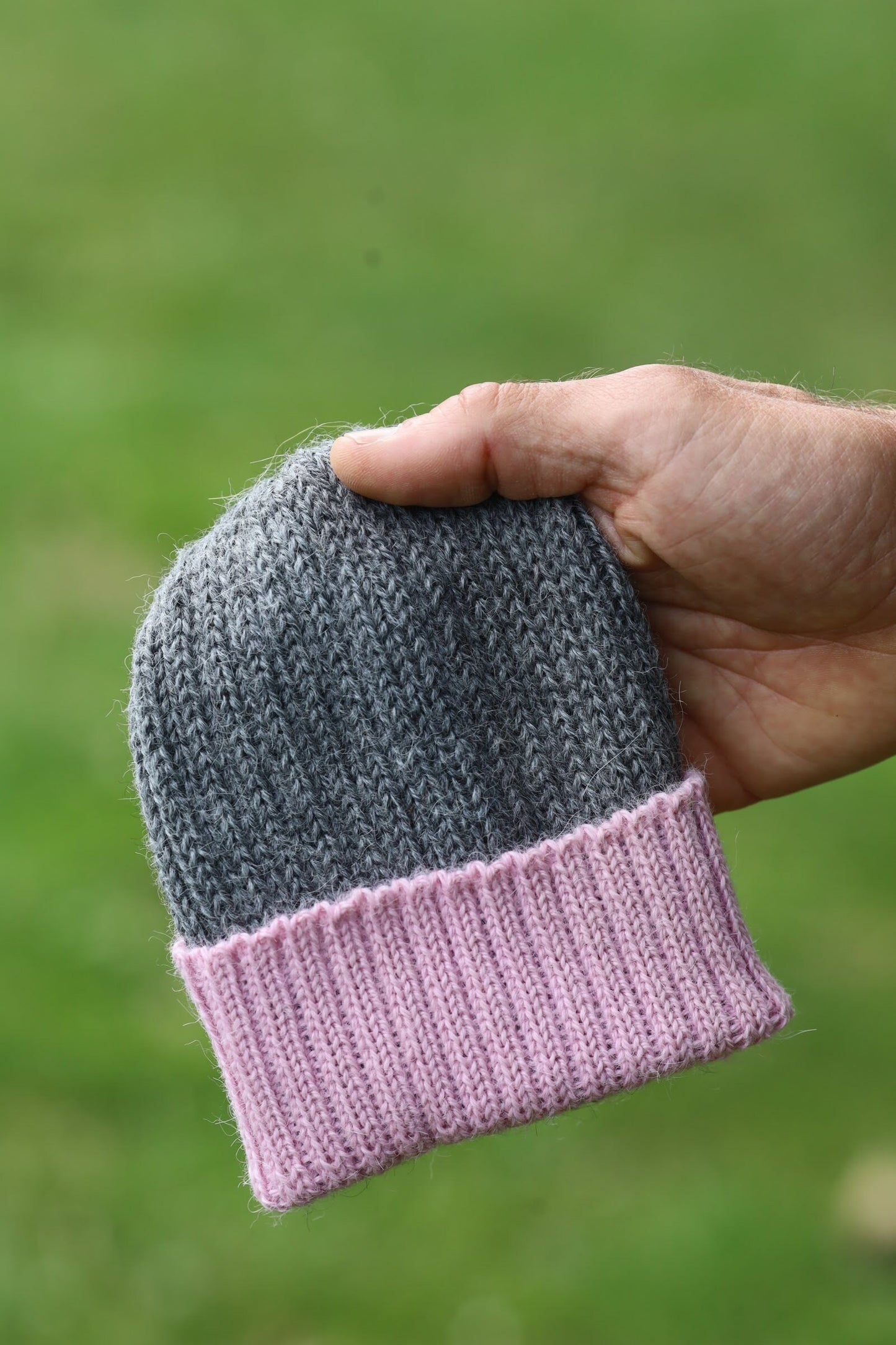 Grey/dusty pink knitted 100% alpaca beanie hat for babies.  Handcrafted in Scotland. Unisex grey/dusty pink watch cap.