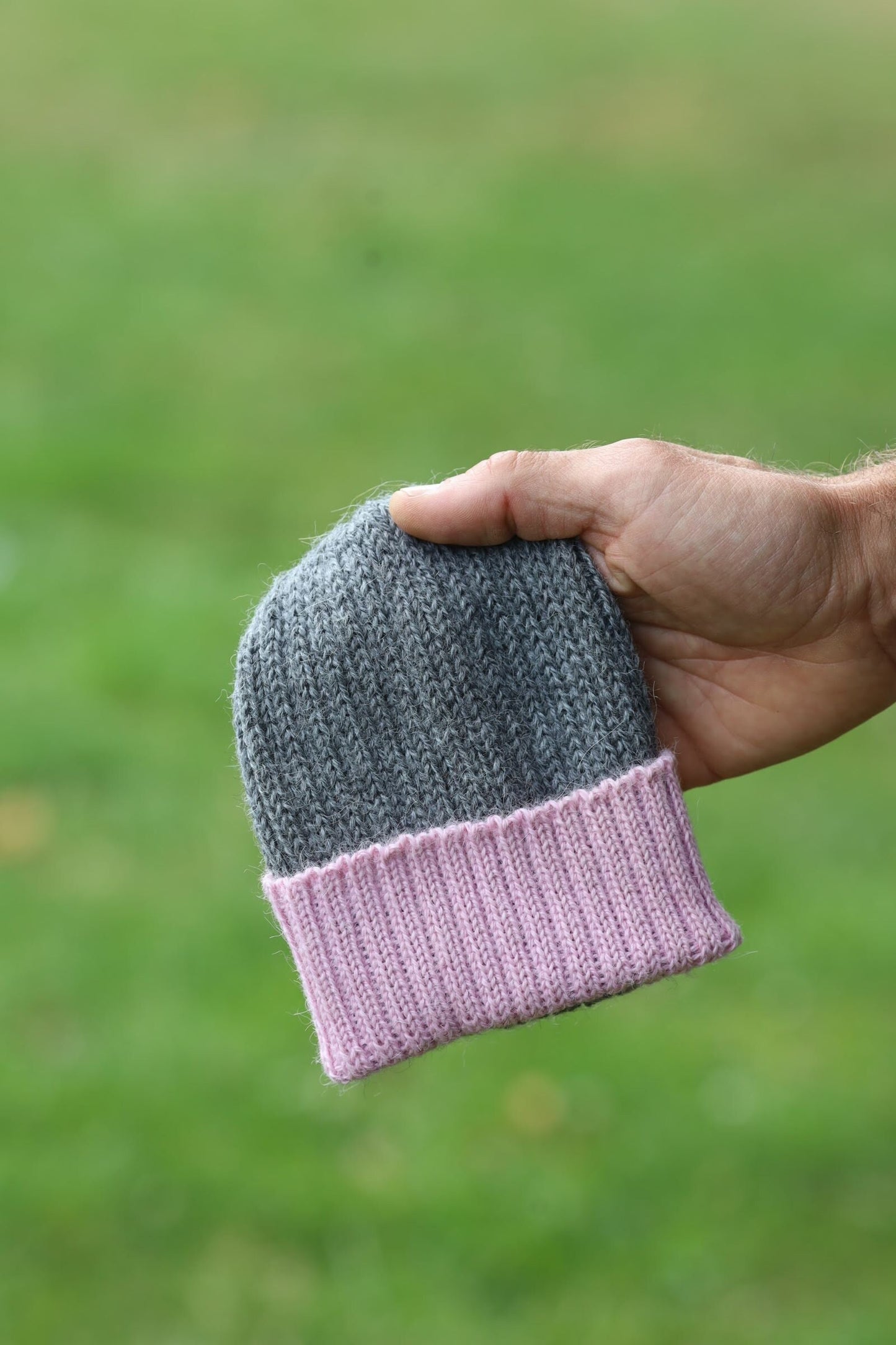 Grey/dusty pink knitted 100% alpaca beanie hat for babies.  Handcrafted in Scotland. Unisex grey/dusty pink watch cap.