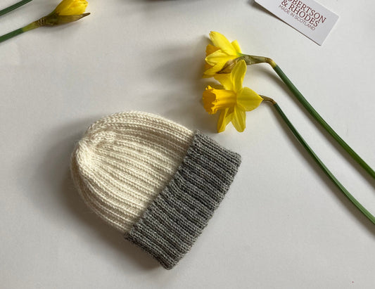 Grey/ecru knitted 100% alpaca beanie hat for babies.  Handcrafted in Scotland. Unisex grey/ecru watch cap.